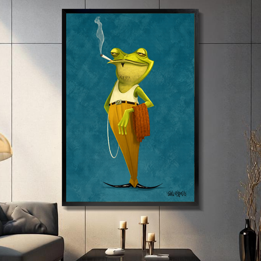 Black framed dapper green frog canvas above a console beside a sofa in a paneled room.