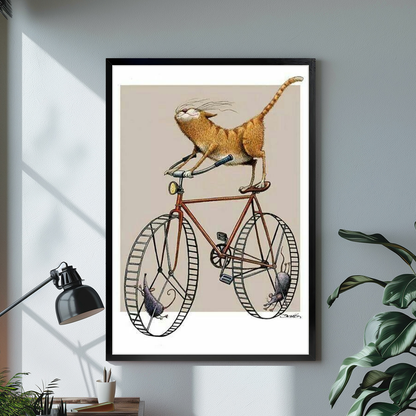 Black framed cycling cat and mice canvas above a desk with lamp and green plant.