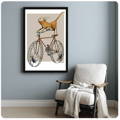 Framed cycling cat and mice artwork beside a pale reading chair against a blue-gray wall.