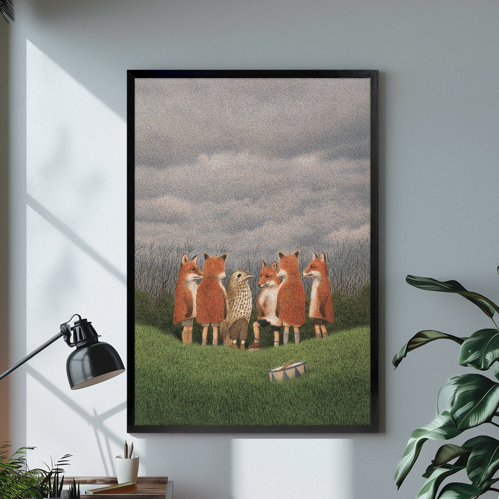 Black framed canvas showing woodland foxes with bird and drum on a bright desk with a lamp.