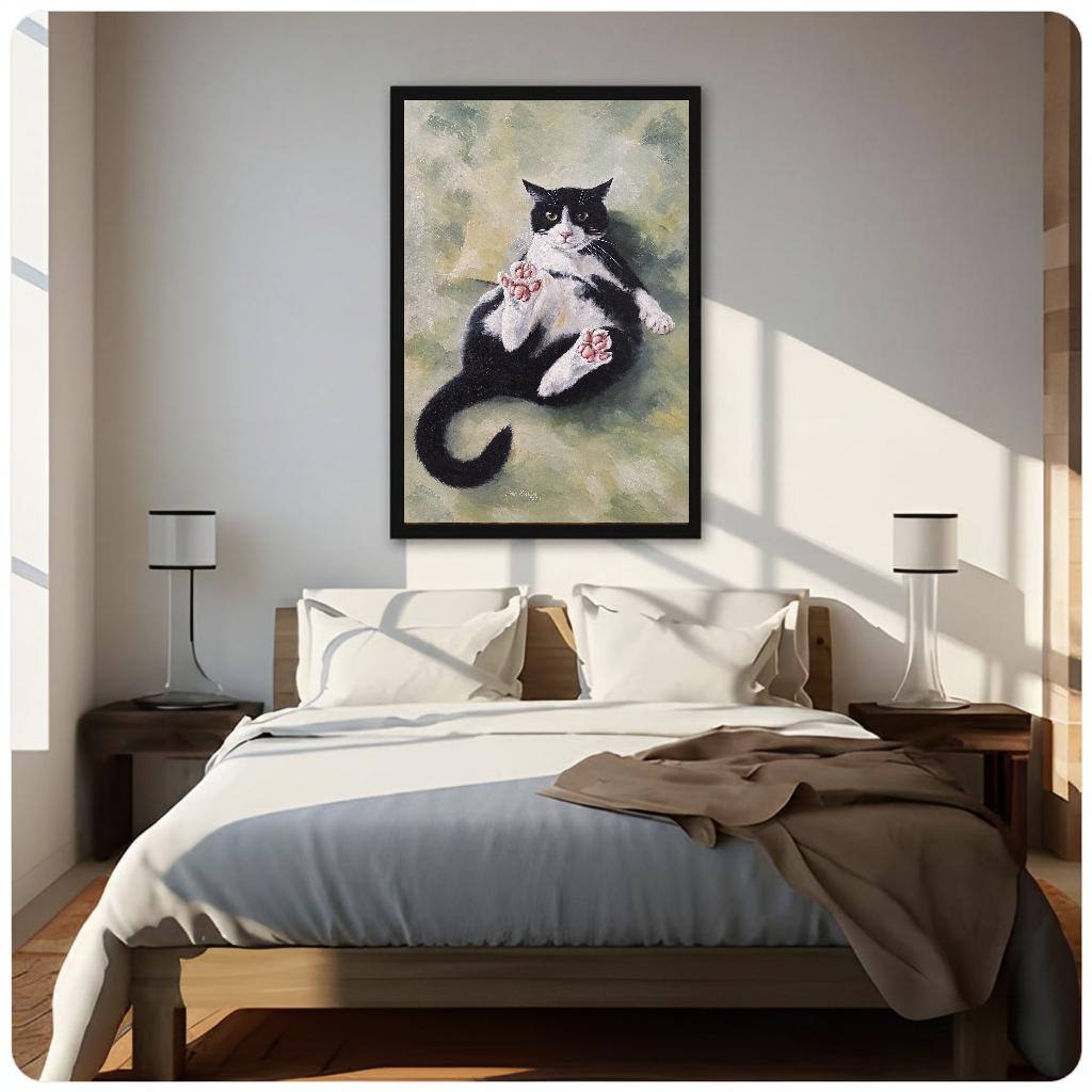 Relaxed tuxedo cat canvas above a neutral bed with lamps and soft window light.