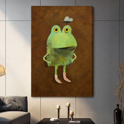 Stretched canvas depicting a green frog wearing striped socks displayed on a gray paneled wall with candles.