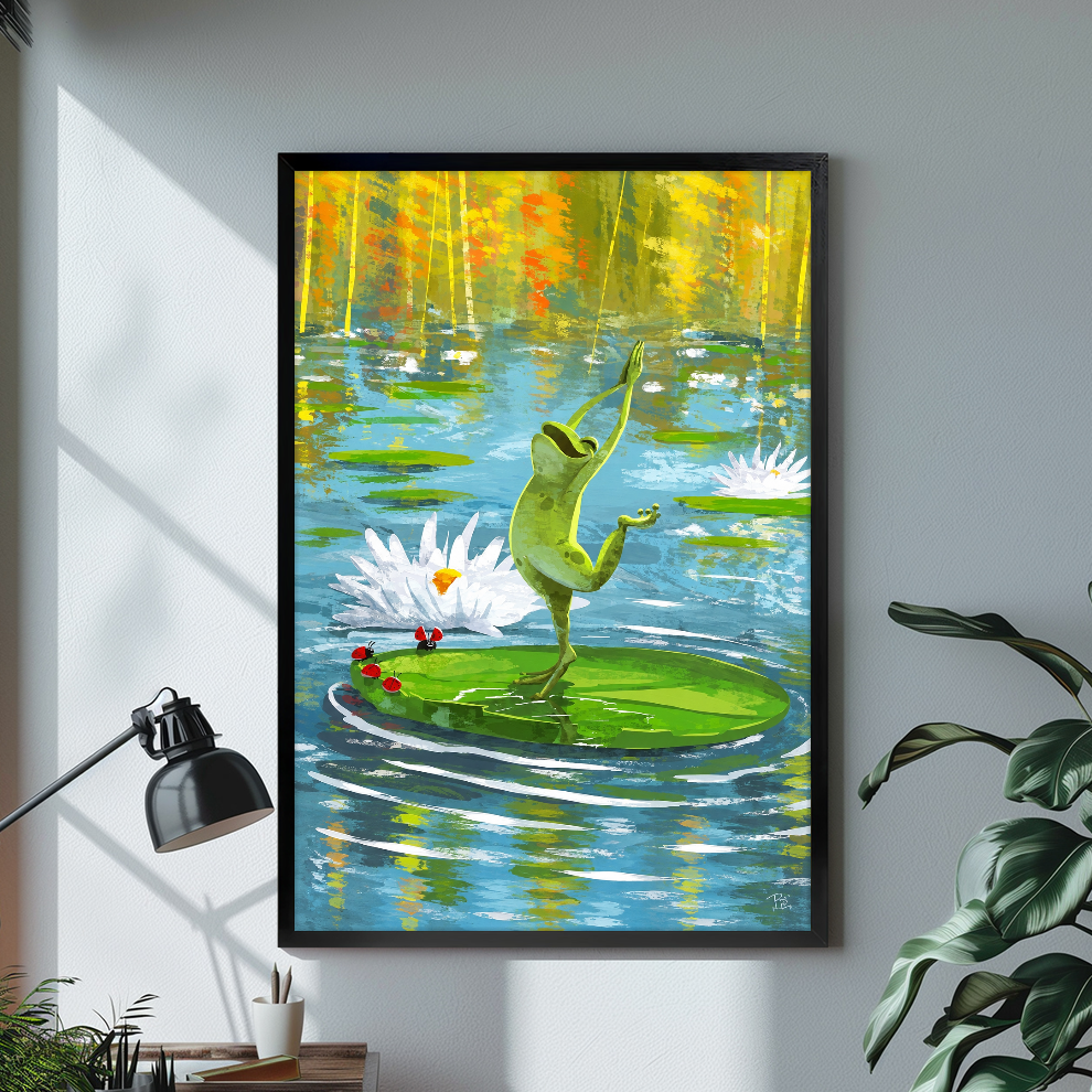 Black framed dancing pond frog canvas above a bright desk with lamp and green plant.