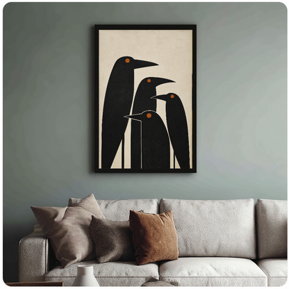 Framed artwork of four minimalist black birds with orange eyes above a sofa with muted cushions.