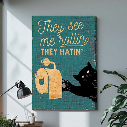 Stretched teal toilet paper cat canvas above a light desk, showing a shaded wrapped side edge.