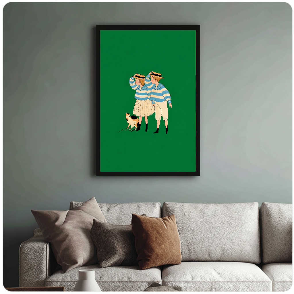 Framed artwork of two striped companions and a calico cat above a sofa with muted cushions.