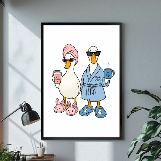 Black framed morning coffee ducks canvas above a bright desk with lamp and green plant.