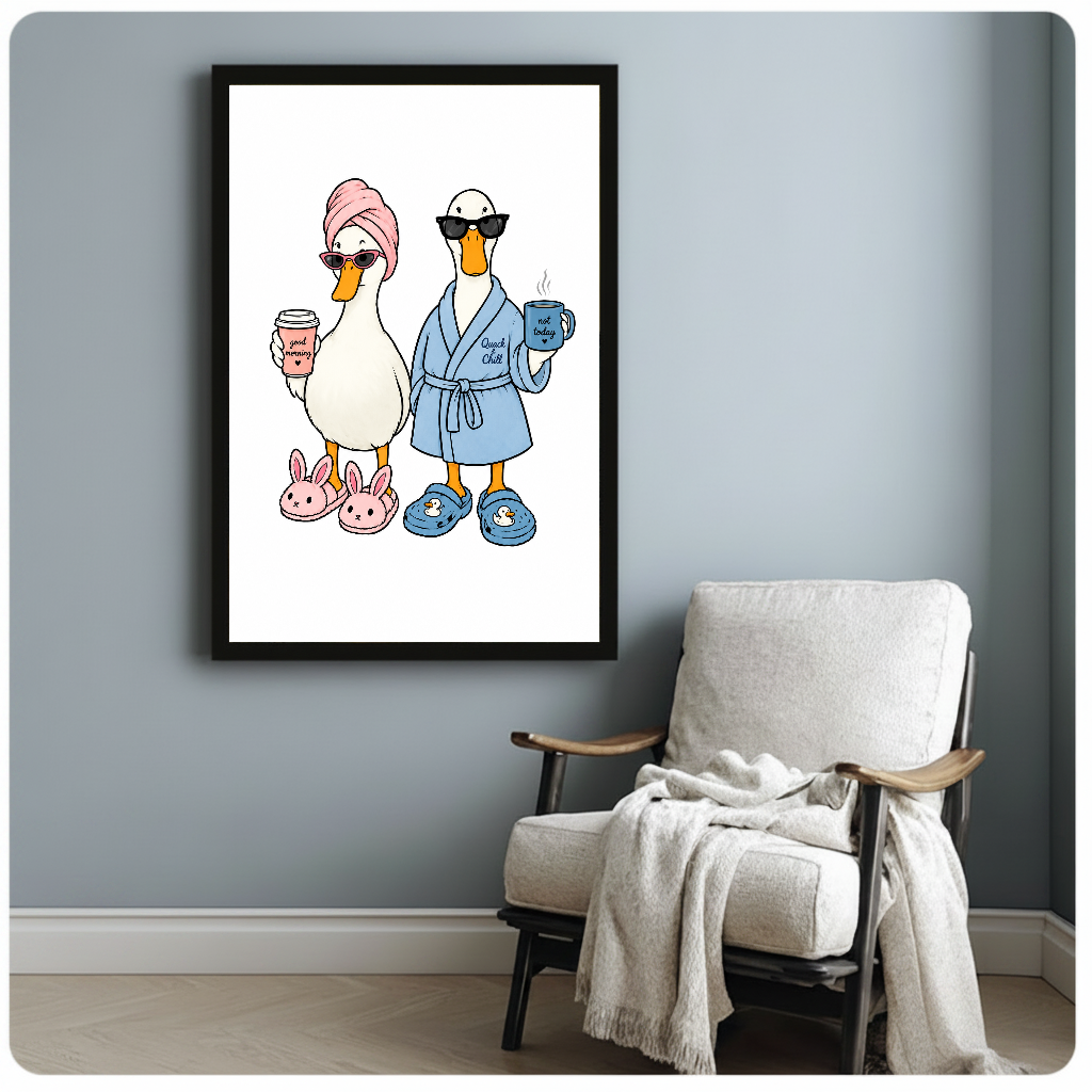 Framed morning coffee ducks artwork beside a pale reading chair against a blue-gray wall.
