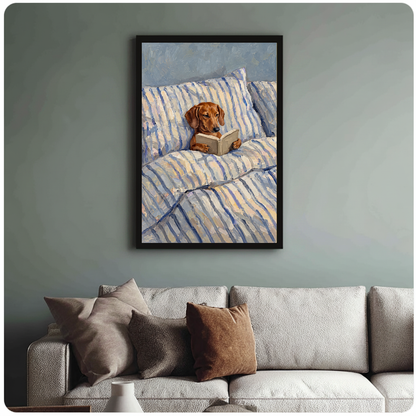 Framed artwork of a dachshund reading in a striped bed above a sofa with muted cushions.
