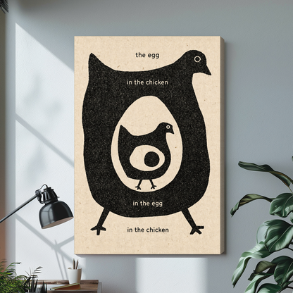 Stretched canvas depicting a chicken and egg question displayed on a bright desk with a lamp.