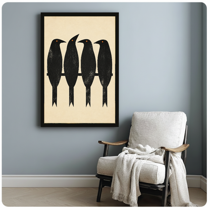 Framed artwork of four black birds perched along a branch beside a pale reading chair against a gray wall.