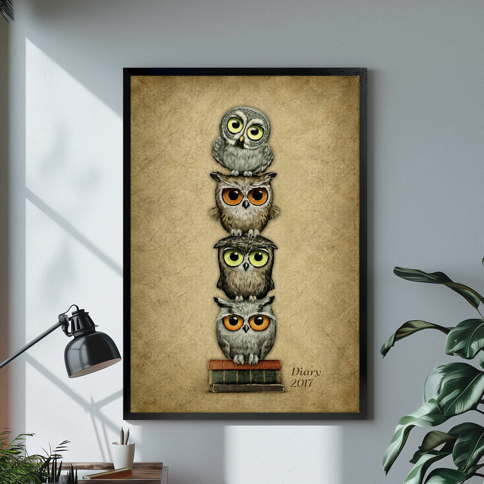 Black framed stacked bookish owls canvas above a desk with lamp and green plant.