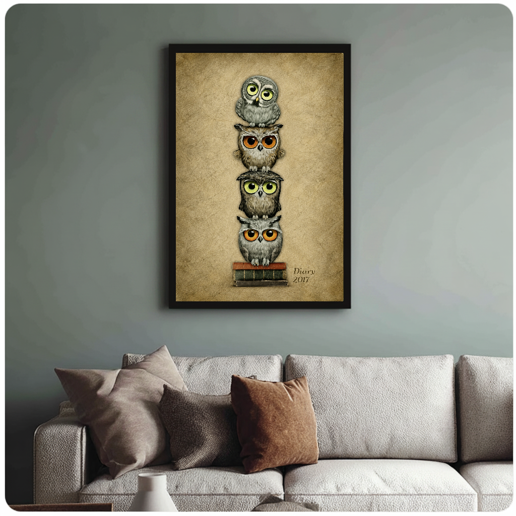 Framed stacked bookish owls painting above a sofa with muted cushions against a green-gray wall.