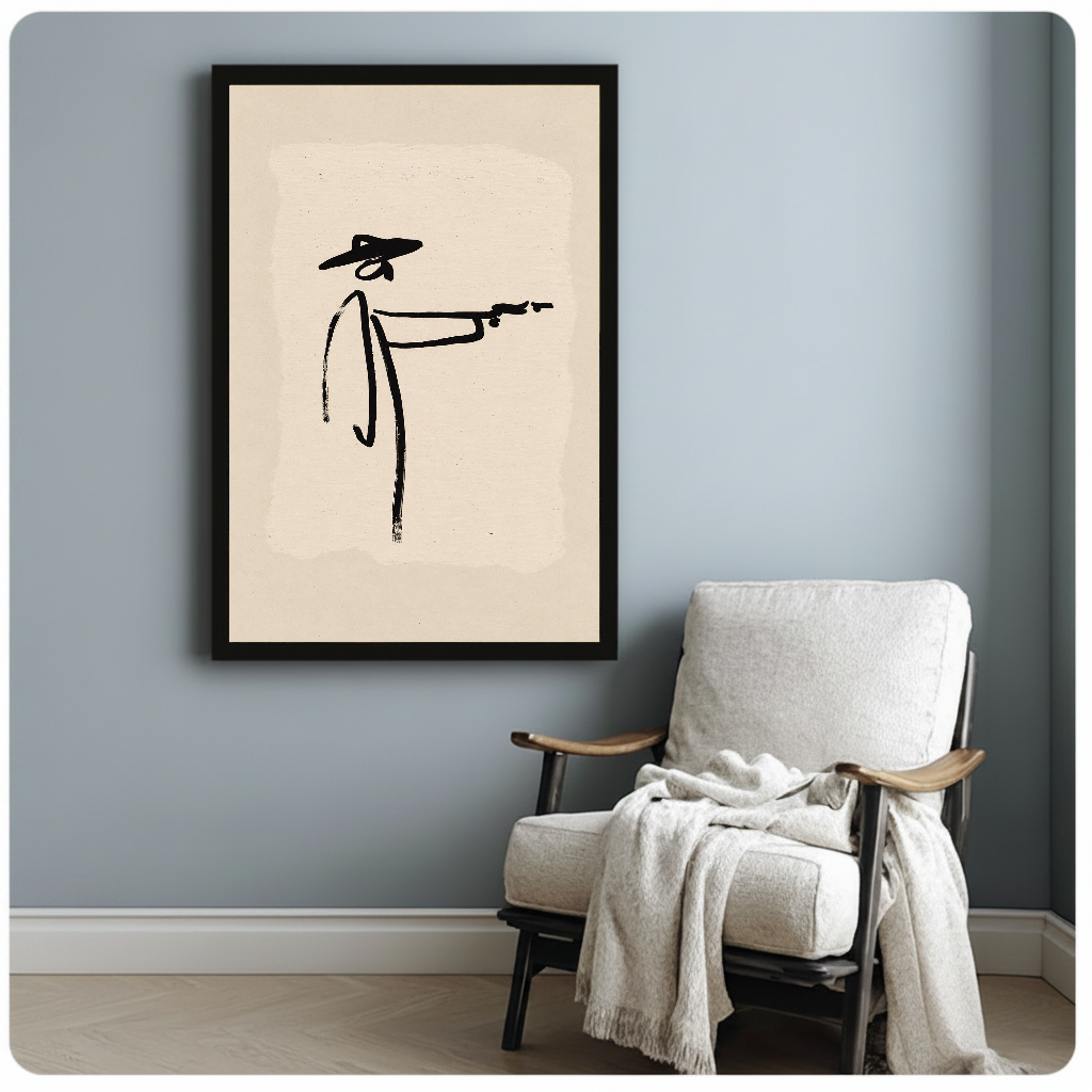 Framed minimalist brushstroke cowboy artwork beside a pale reading chair against a blue-gray wall.