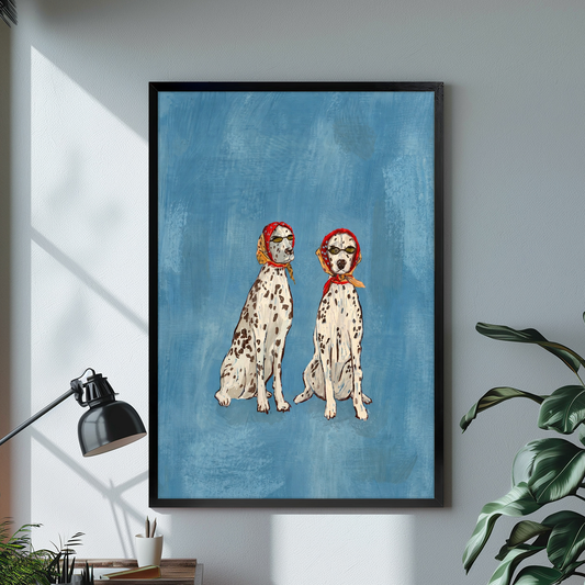 Black framed scarf wearing dalmatian pair canvas on a pale wall above a desk and plant.