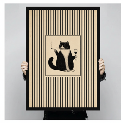 A person holds black framed grumpy cat wine portrait canvas against a light neutral background.