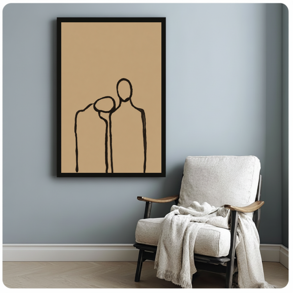 Framed quiet shoulder companionship canvas beside a pale reading chair on a blue gray wall.