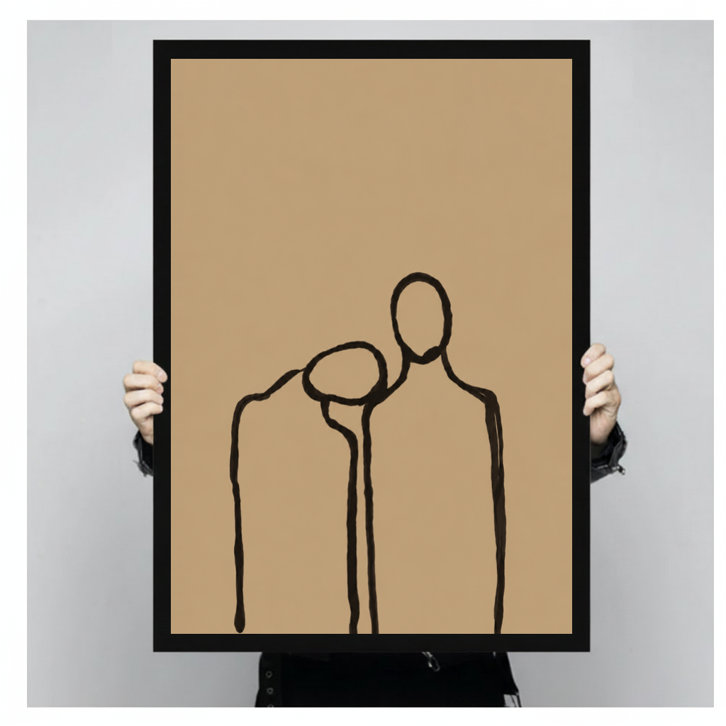 A person holds black framed quiet shoulder companionship canvas against a light neutral background.