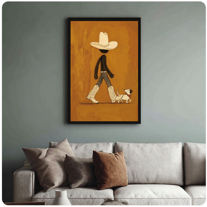 Framed cowboy walking a small dog canvas above a neutral sofa with cushions against a muted wall.