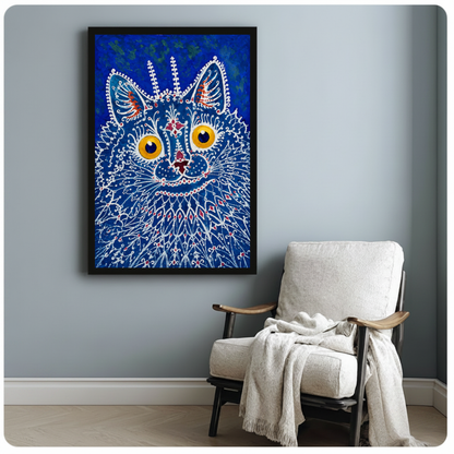 Framed blue lacework cat canvas beside a pale reading chair on a blue gray wall.