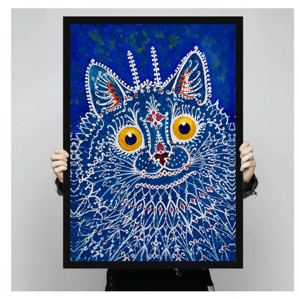 A person holds black framed blue lacework cat canvas against a light neutral background.