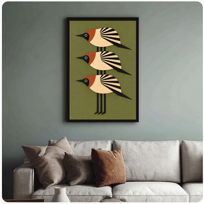 Framed three stacked folk birds canvas above a neutral sofa with cushions against a muted wall.
