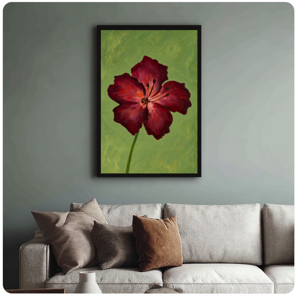 Framed burgundy bloom on olive canvas above a neutral sofa with cushions against a muted wall.