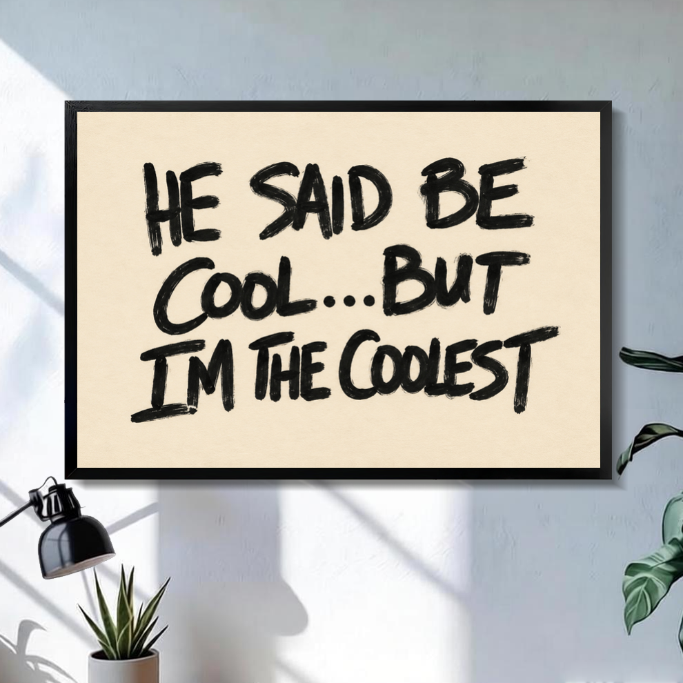Black framed he said be cool quote canvas above a console in the selected room setting.