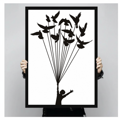Framed birds lift a dream canvas held by a person against a light neutral background.