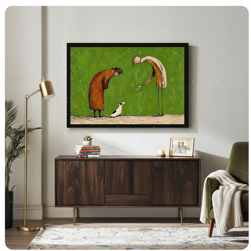 Framed kind strangers small dog canvas above a wooden sideboard beside books and an angled brass lamp.