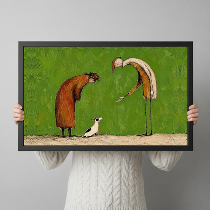 Framed kind strangers small dog canvas held horizontally by a person wearing a cream sweater against a light background.