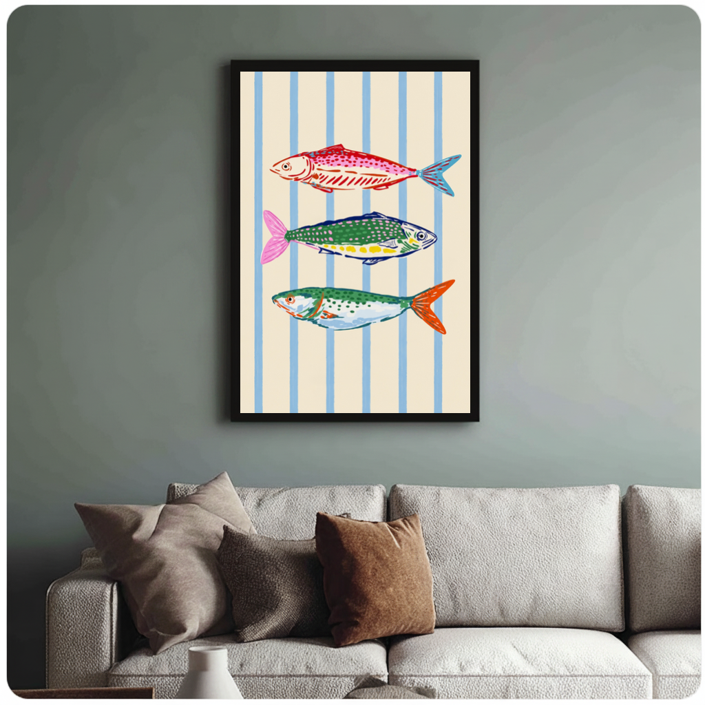 Framed colorful fish blue stripes canvas above a neutral sofa with cushions against a muted wall.