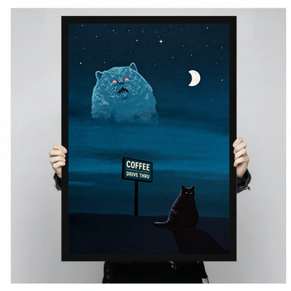 Framed night cat and giant vision canvas held by a person against a light neutral background.