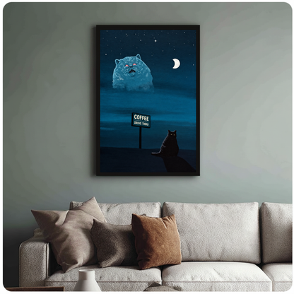 Framed night cat and giant vision canvas above a neutral sofa with cushions against a muted wall.