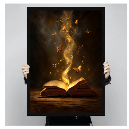 Framed enchanted book butterfly light canvas held by a person against a light neutral background.
