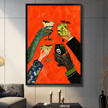 Black framed monster hands cocktail toast canvas on a dark paneled wall beside warm candles.