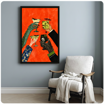 Framed monster hands cocktail toast canvas beside a pale reading chair on a blue gray wall.