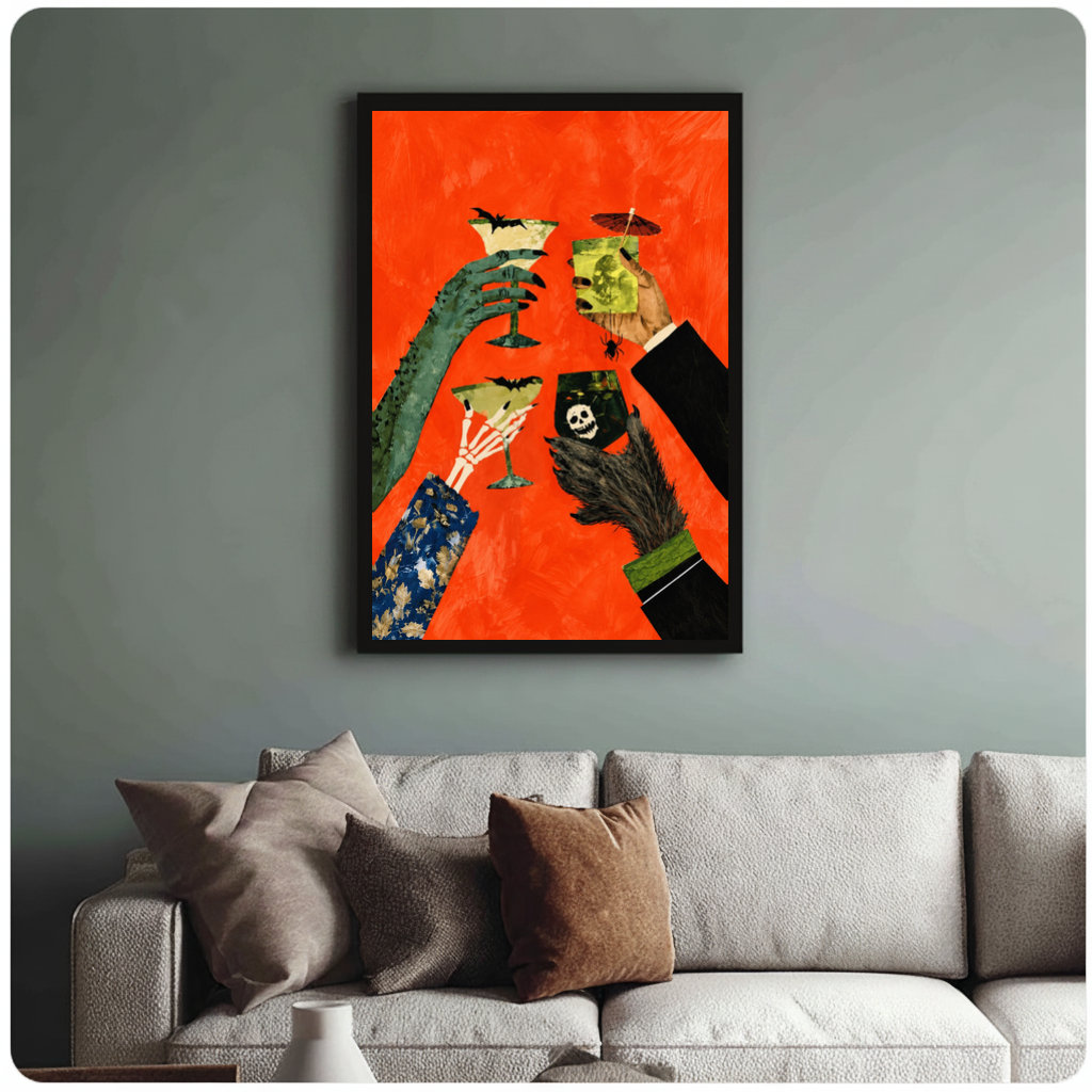 Framed monster hands cocktail toast canvas above a neutral sofa with cushions against a muted wall.