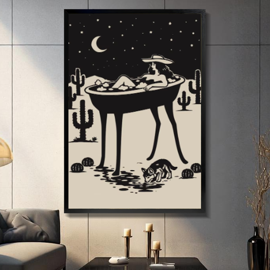Black framed cowgirl bath under stars canvas on a dark paneled wall beside warm candles.