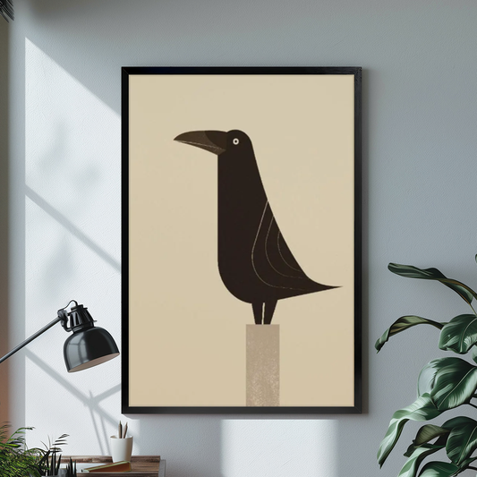 Black framed minimal raven on pedestal canvas on a pale wall above a desk and plant.