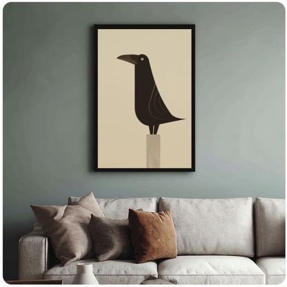 Framed minimal raven on pedestal canvas above a neutral sofa with cushions against a muted wall.