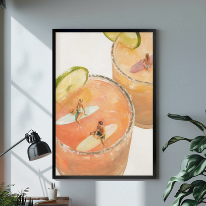 Black framed tiny surfers cocktail pools canvas on a pale wall above a desk and plant.