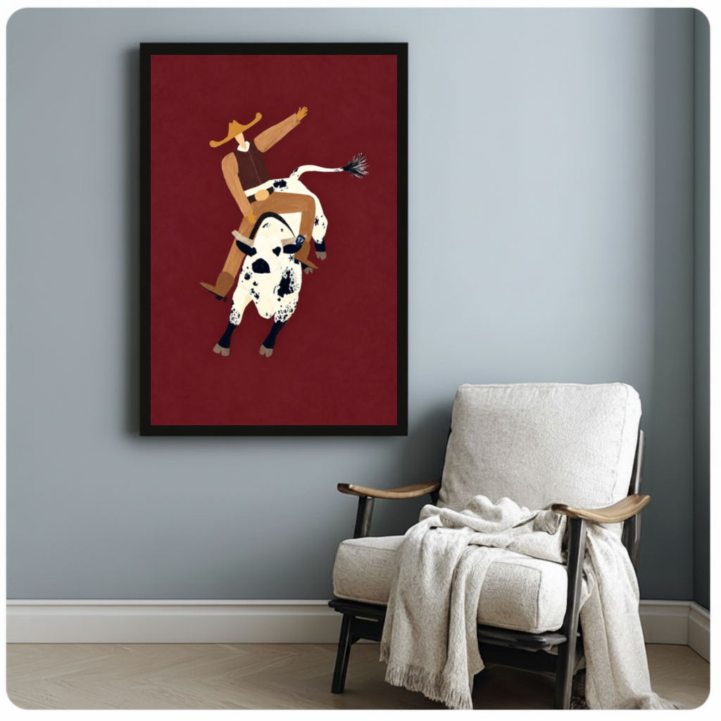 Framed burgundy rodeo rider canvas beside a pale reading chair on a blue gray wall.