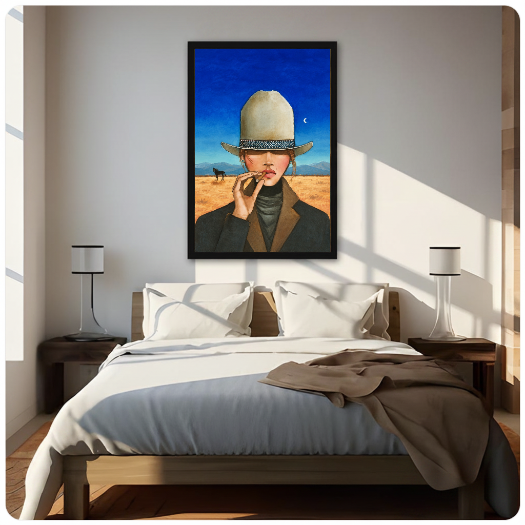 Framed blue sky cigar cowgirl canvas above a neutral bed beside soft bedroom lighting and lamps.