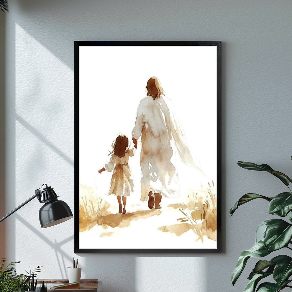 Black framed jesus walking with child canvas on a pale wall above a desk and plant.