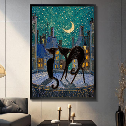 Black framed moonlit city black cats canvas on a dark paneled wall beside warm candles.
