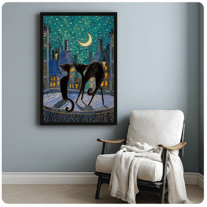 Framed moonlit city black cats canvas beside a pale reading chair on a blue gray wall.