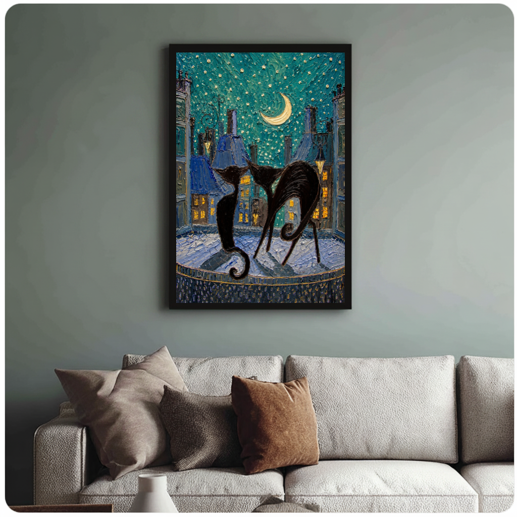 Framed moonlit city black cats canvas above a neutral sofa with cushions against a muted wall.