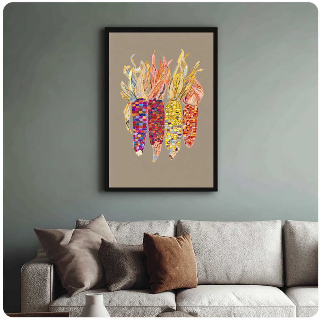 Framed colorful beaded corn canvas above a neutral sofa with cushions against a muted wall.