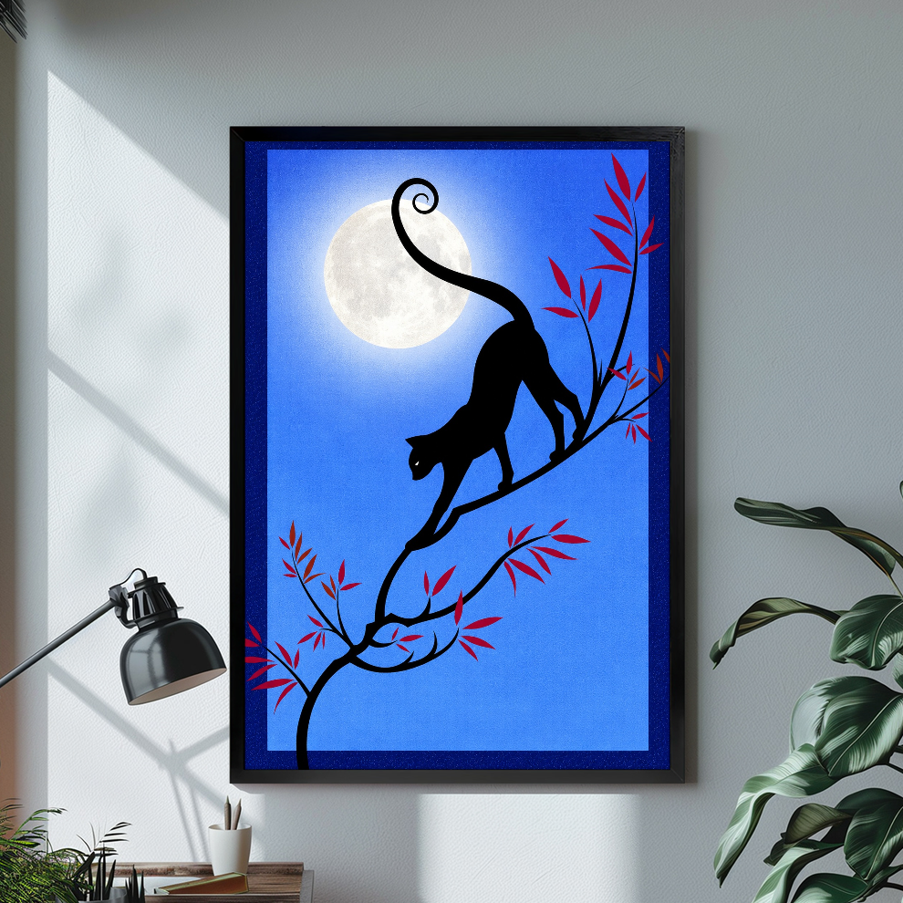 Black framed moonlit branch black cat canvas on a pale wall above a desk and plant.